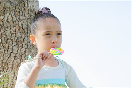 Japanese Girl Licking Lollipop Foto de stock - Con derechos protegidos, Código: 859-03782430