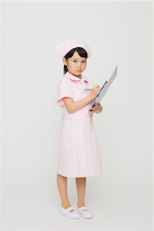 shy children - Japanese Girl Dressed As Nurse Stock Photo - Rights-Managed, Code: 859-03806092