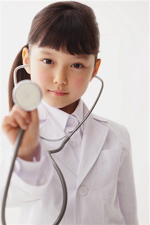 portrait medical white background not animal not smiling - Girl Listening With Stethoscope Stock Photo - Rights-Managed, Code: 859-03806129