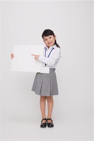 sign (any sort of textual, symbolic, printed or blank sign) - Girl as Office Worker Holding Placard Stock Photo - Rights-Managed, Code: 859-03806136