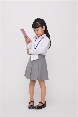 Girl as Office Worker Using Cellular Phone Stock Photo - Rights-Managed, Code: 859-03806139