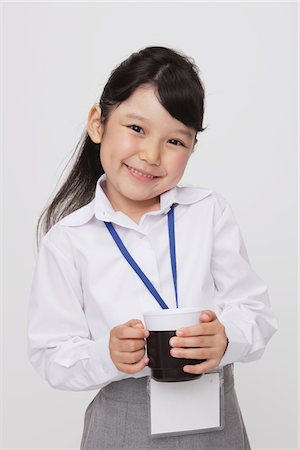 Girl as Office Worker Holding Cup Stock Photo - Rights-Managed, Code: 859-03806153