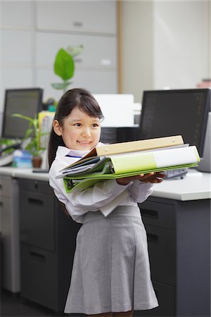desktop - Girl as Office Worker Holding Document Folder Stock Photo - Rights-Managed, Code: 859-03806188