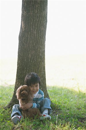 people animal cuddle - Little Boy with Poodle Dog Stock Photo - Rights-Managed, Code: 859-03806239