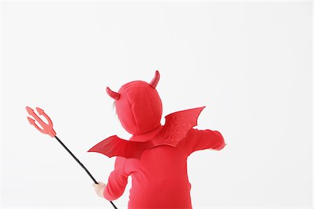Boy in Red Devil Costume Foto de stock - Con derechos protegidos, Código: 859-03806254