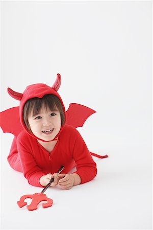 simsearch:693-06379982,k - 3 Year Boy Dressed Up As Devil Laughing Stock Photo - Rights-Managed, Code: 859-03806252