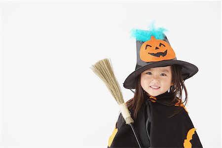 person holding broom - Girl Dressed Up As Witch Stock Photo - Rights-Managed, Code: 859-03806289