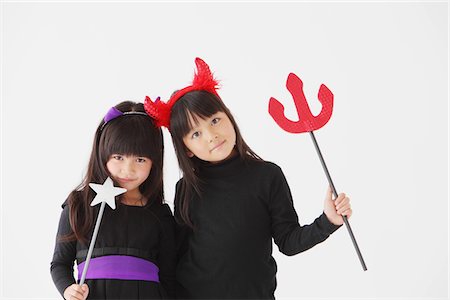 Two Girl Dressed In Halloween Costume Foto de stock - Con derechos protegidos, Código: 859-03806300