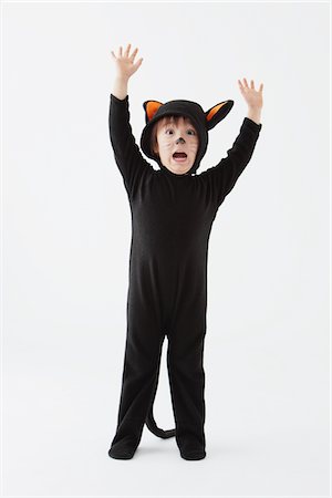 dressing up as a cat for halloween - Boy Dressed As Cat Costume Stock Photo - Rights-Managed, Code: 859-03806324