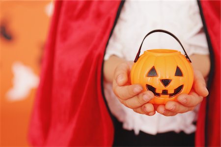 Human Hands Holding Pumpkin Bucket Stock Photo - Rights-Managed, Code: 859-03806364