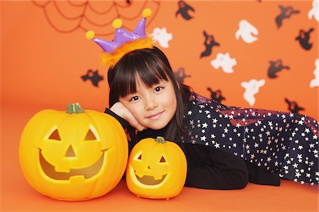 Girl in Costume for Halloween with Pumpkin Stock Photo - Rights-Managed, Code: 859-03806360