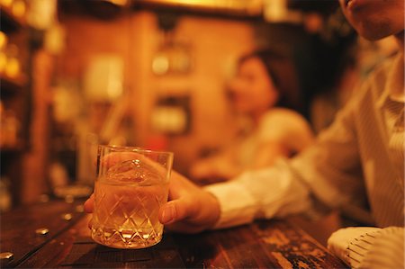 people at bar counter - Man holding whiskey glass Stock Photo - Rights-Managed, Code: 859-03807204