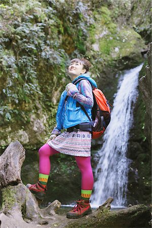 esploratrice - Amused Young Woman Hiker Near Waterfall Fotografie stock - Rights-Managed, Codice: 859-03839474