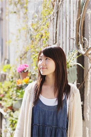Japanese Teenage Girl Standing Near A House Wall Stock Photo - Rights-Managed, Code: 859-03839889