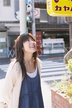 street shop in tokyo - Teenage Girl Looking Up By Roadside Stock Photo - Rights-Managed, Code: 859-03839954