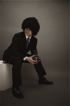 Portrait d'un jeune homme Multiracial posant dans un Studio Photographie de stock - Rights-Managed, Code: 859-03839969
