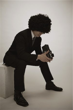 Portrait Of A Multiracial Young Man Posing In A Studio Foto de stock - Con derechos protegidos, Código: 859-03839970