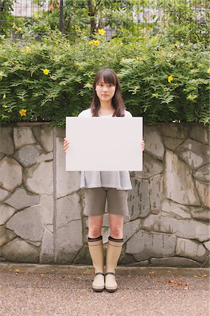 Young adult woman holding White board Foto de stock - Con derechos protegidos, Código: 859-03840054