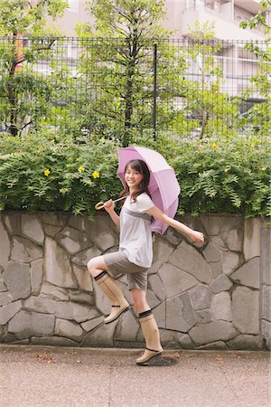 people walking on road side - Young adult woman skipping Stock Photo - Rights-Managed, Code: 859-03840052