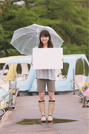 Young adult woman holding White board Foto de stock - Con derechos protegidos, Código: 859-03840129