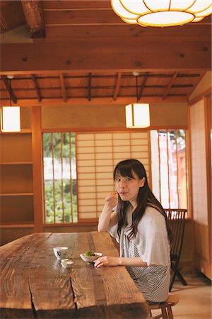 Young adult woman eating dessert Stock Photo - Rights-Managed, Code: 859-03840120