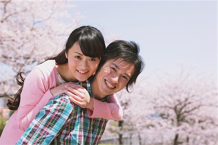 Young Couple in Front of Cherry blossoms Stock Photo - Rights-Managed, Code: 859-03840170