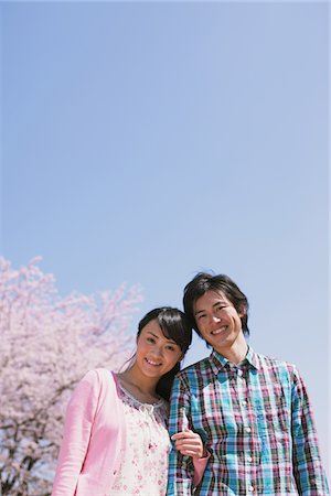 Young Couple in Front of Cherry blossoms Stock Photo - Rights-Managed, Code: 859-03840215