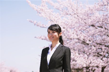 simsearch:859-06380168,k - Businesswoman in Front of Cherry blossoms Stock Photo - Rights-Managed, Code: 859-03840224