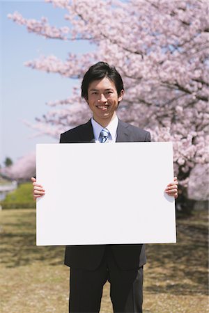 Businessman Holding White Board Stock Photo - Rights-Managed, Code: 859-03840241
