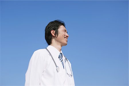 doctor low angle shot - Doctor Looking Away Stock Photo - Rights-Managed, Code: 859-03840268