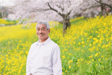 simsearch:859-03840315,k - Portrait Of Middle-Aged Man Yellow Wildflower In Background Stock Photo - Rights-Managed, Code: 859-03840349