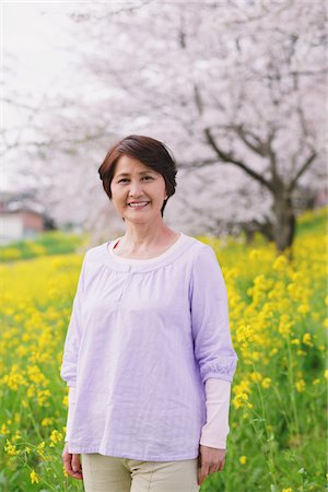 flower bed grass - Portrait Of Middle-Aged Woman Standing Near Flowerbed Stock Photo - Rights-Managed, Code: 859-03840353