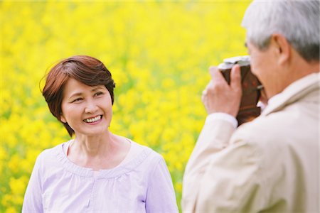 flower beds - Middle-Aged Man Taking Picture Of His Wife Stock Photo - Rights-Managed, Code: 859-03840369