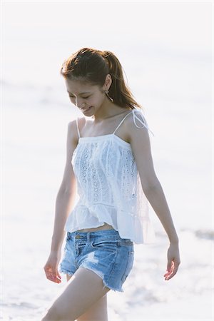 exotic scenes - Young Woman Wading At Seaside Stock Photo - Rights-Managed, Code: 859-03840431