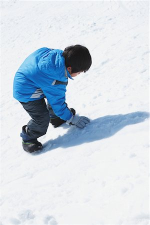 Boy Climbing Up In Snow Stock Photo - Rights-Managed, Code: 859-03840618