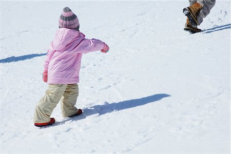 Girl Walking In Snow Stock Photo - Rights-Managed, Code: 859-03840654