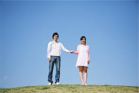 simsearch:859-03806928,k - Young adult couple on Grass hill Stock Photo - Rights-Managed, Code: 859-03840841