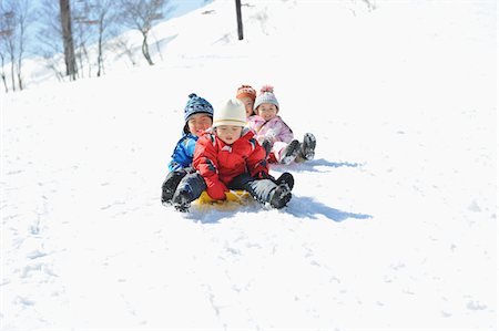 snow sledge - Children Sledging In Snow Stock Photo - Rights-Managed, Code: 859-03840936