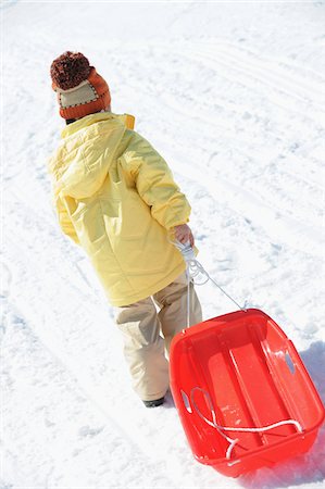 Girl Carrying Sledge Stock Photo - Rights-Managed, Code: 859-03840996