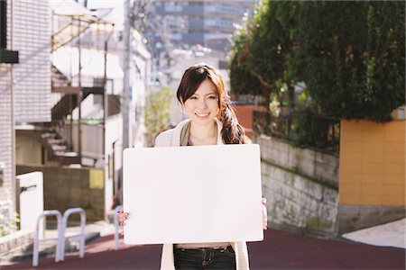 person holding blank sign - Japanese Women Holding Whiteboard Stock Photo - Rights-Managed, Code: 859-03860492