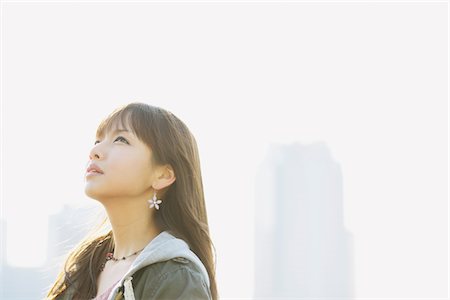 profile view asians - Young Woman Looking Up Stock Photo - Rights-Managed, Code: 859-03860534