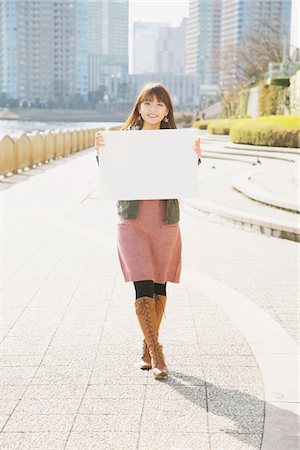 ethnic holding sign - Japanese Women Holding Whiteboard Stock Photo - Rights-Managed, Code: 859-03860559