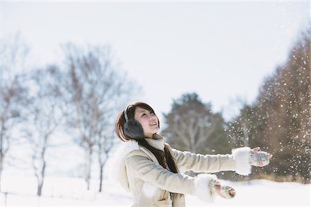 Teenage Girl Enjoying Snow Foto de stock - Con derechos protegidos, Código: 859-03860625