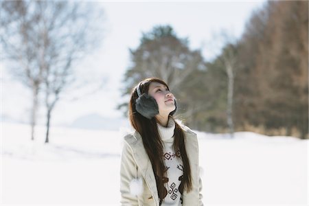 earmuffs - Teenage Girl Wearing Winter Clothing Looking Up Stock Photo - Rights-Managed, Code: 859-03860628
