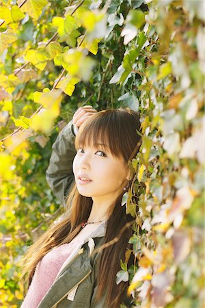 Japanese Women Leaning Near Leaves Stock Photo - Rights-Managed, Code: 859-03860620