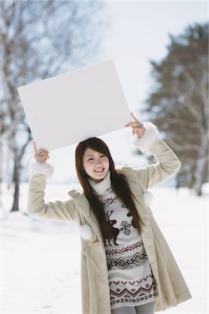 Teenage Girl Holding Whiteboard On Her Head Stock Photo - Rights-Managed, Code: 859-03860634