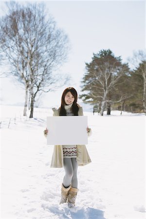 ethnic holding sign - Teenage Girl Holding Whiteboard Stock Photo - Rights-Managed, Code: 859-03860632