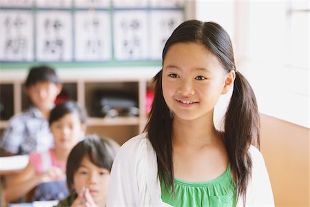 Schoolgirl Answering In Classroom Stock Photo - Rights-Managed, Code: 859-03860772