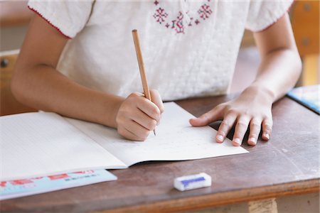 Student Writing In Notebook Stock Photo - Rights-Managed, Code: 859-03860798