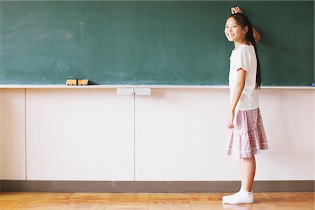 study (room) - Schoolgirl Writing On Chalkboard Stock Photo - Rights-Managed, Code: 859-03860820